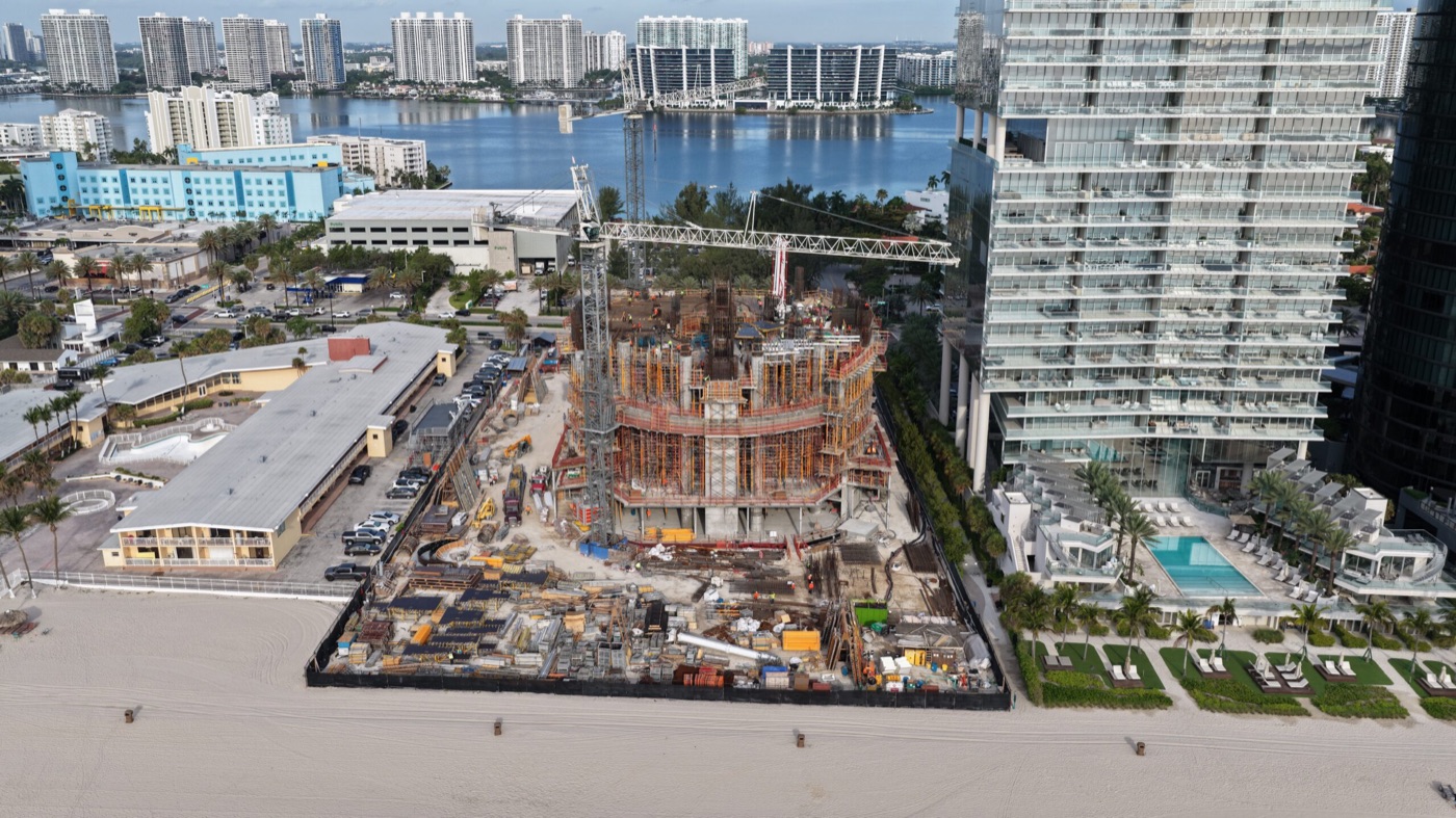 Bentley Residences construction progress June 2026, 62-story tower going vertical in Sunny Isles Beach Miami