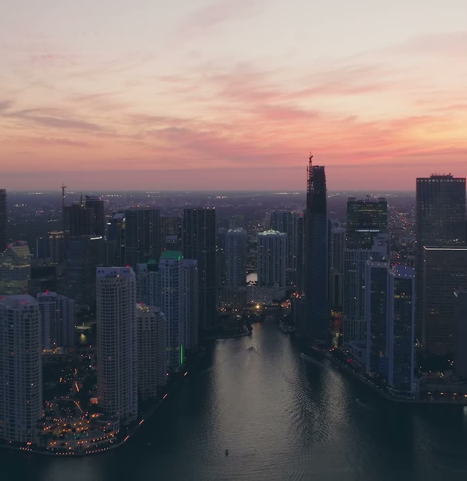 Aerial view of the Miami River running through Brickell and Downtown Miami at sunset