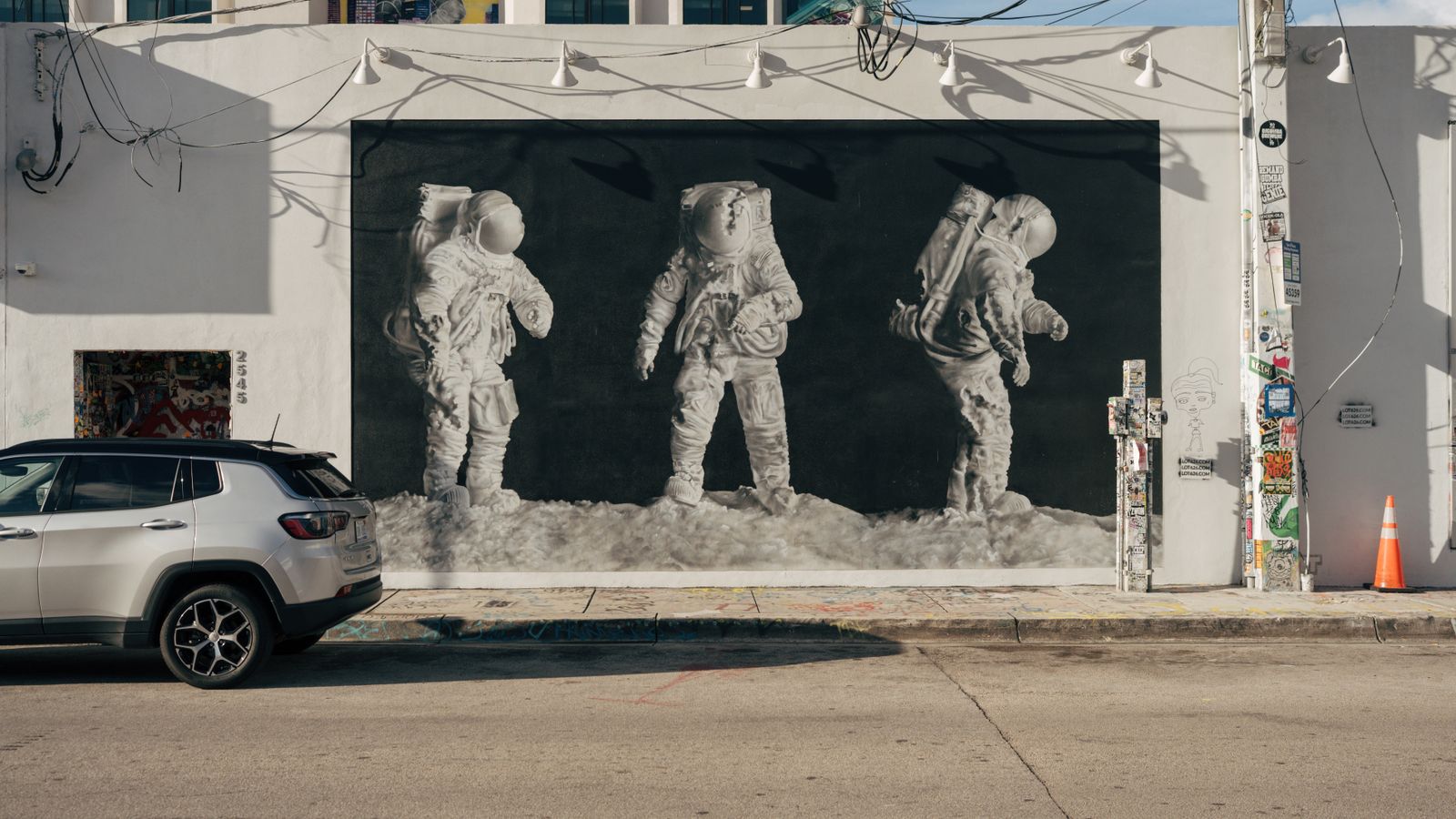 Astronaut mural painted across a Wynwood warehouse facade in Miami