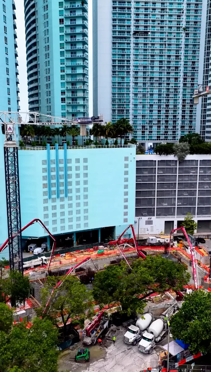 Edge House Miami foundation pour with concrete pump trucks, Edgewater Miami, July 2026