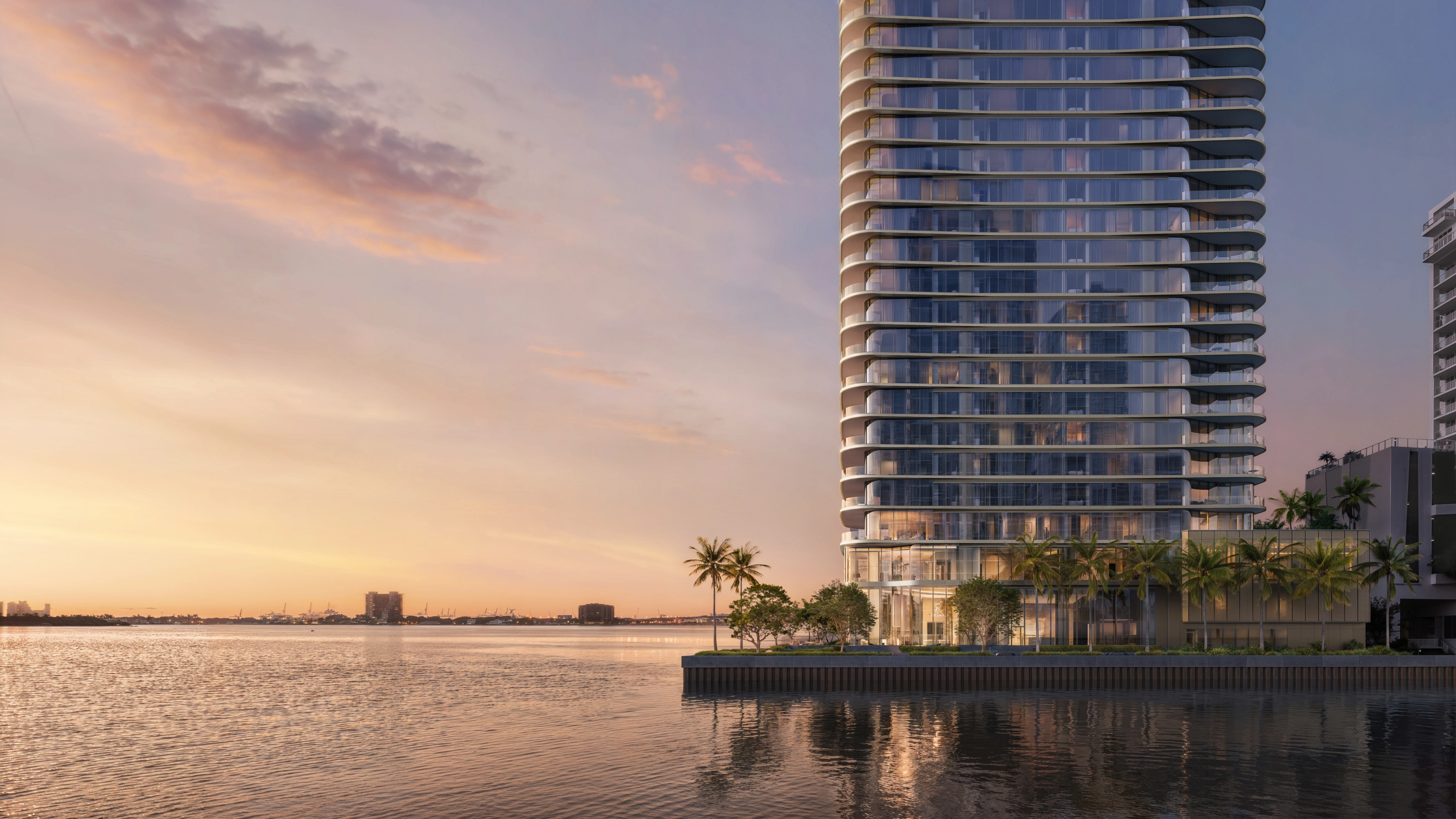 LILLI north facade rendering at dusk beside Biscayne Bay and palm trees
