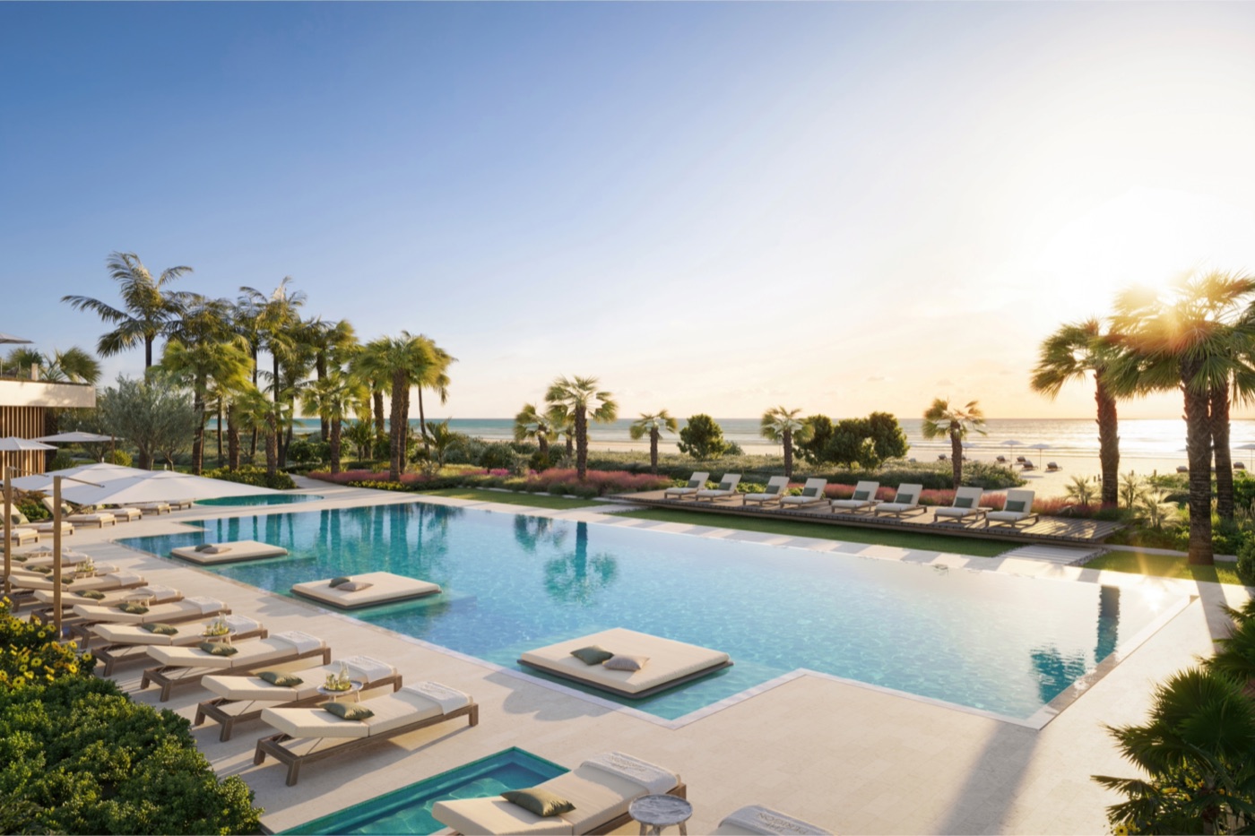 Renderização da piscina à beira-mar e deck de cabanas do The Perigon Miami Beach com vistas para o Atlântico