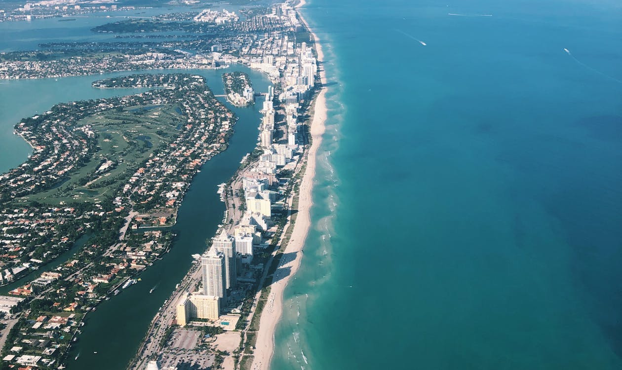 Luxury glass condo tower in South Beach Miami illustrating the scale of the approved 106-unit, 330-foot 1250 West Avenue project by Terra, RG Development, and GV Development