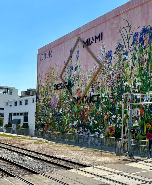 Dior x Miami Design District floral mural near the future Kempinski Residences Miami Design District site at 3801 and 3883 Biscayne Boulevard where DaGrosa Capital delivers Kempinski's first U.S. residential project with Rockwell Group interiors