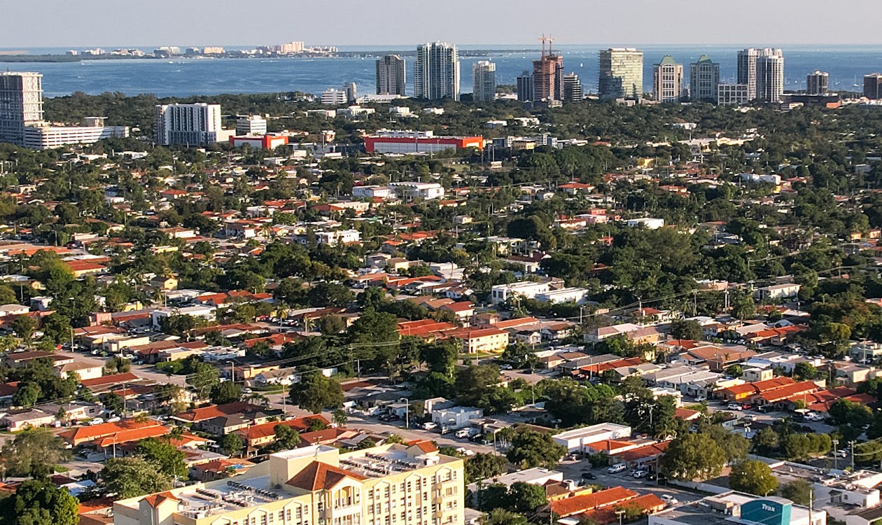 Aerial view of Miami showing the dense urban core and skyline that anchors Brickell's branded condo market