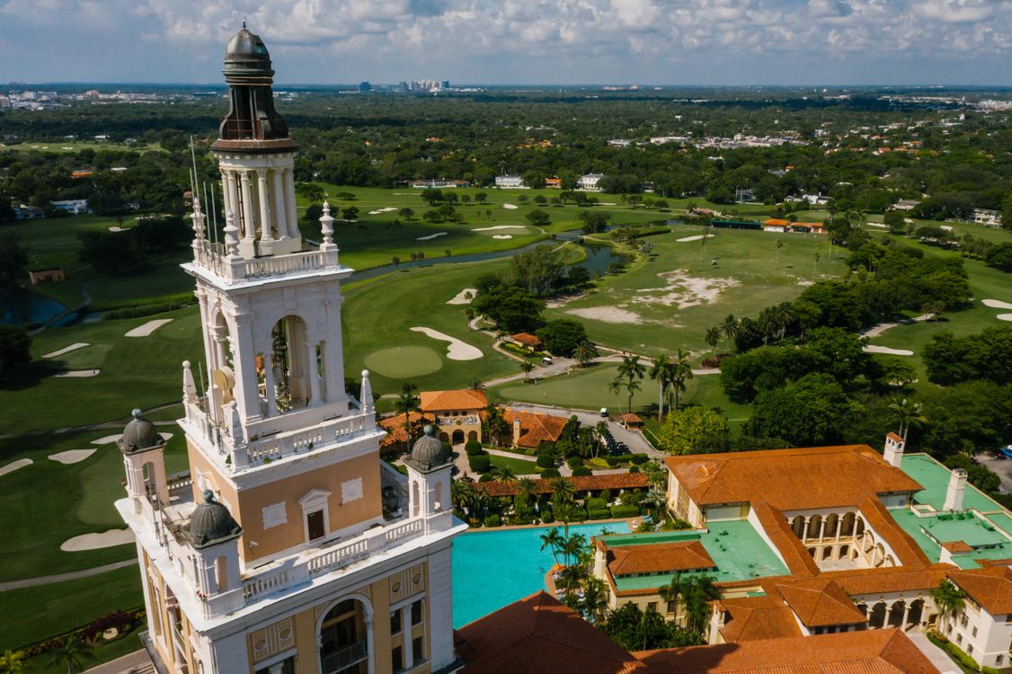 Aerial of the Coral Gables Biltmore tower where Alhambra Parc closed a $100M construction loan in June 2026