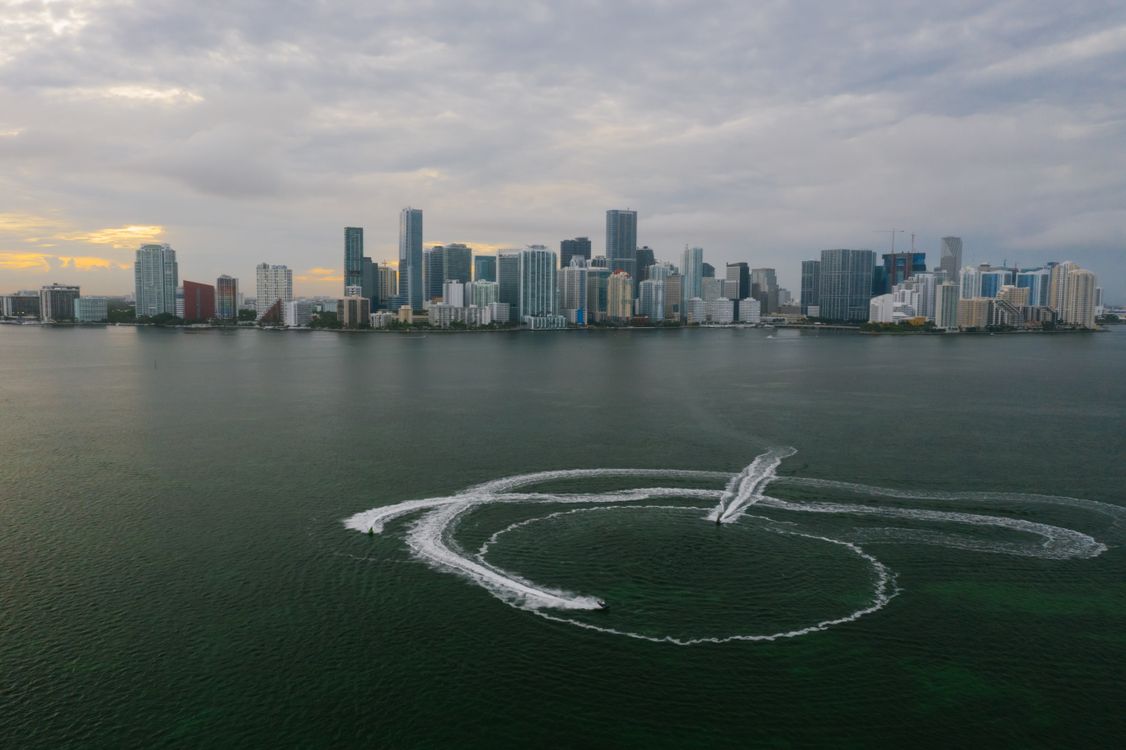 Aerial view of Miami's Brickell and downtown skyline of branded luxury condo towers across Biscayne Bay in Florida