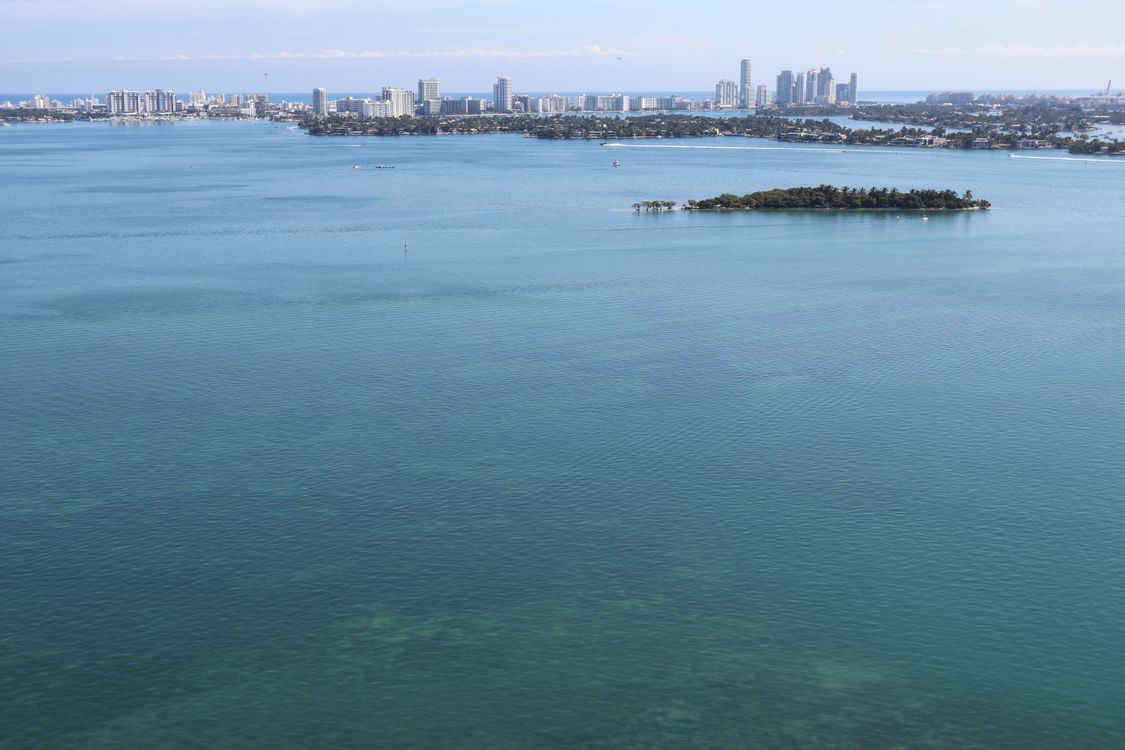 Aerial of Biscayne Bay with the Miami Beach skyline, where finite waterfront land keeps oceanfront condo supply tight in 2026