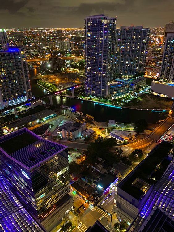 Downtown Miami skyline at night, where 83 statewide rate-decrease filings took effect in January 2026