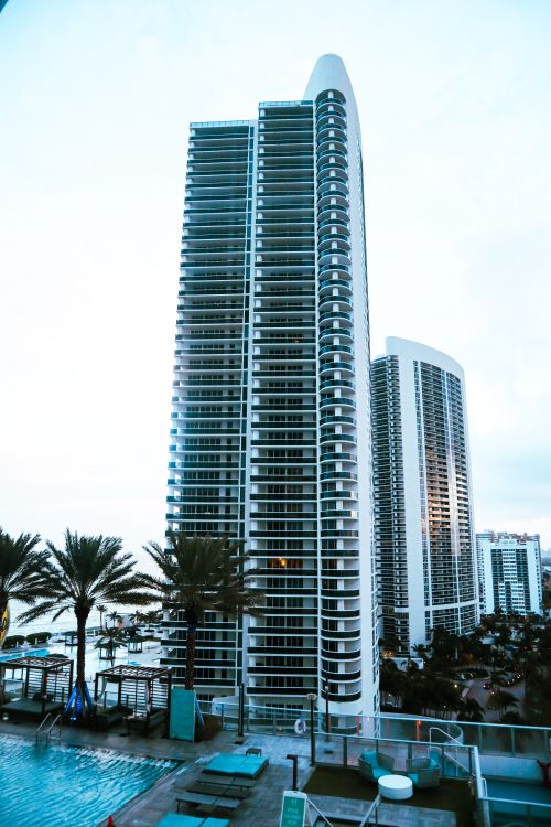 Sunny Isles oceanfront condo tower with pool deck where coastal master policies see the largest 2026 insurance relief