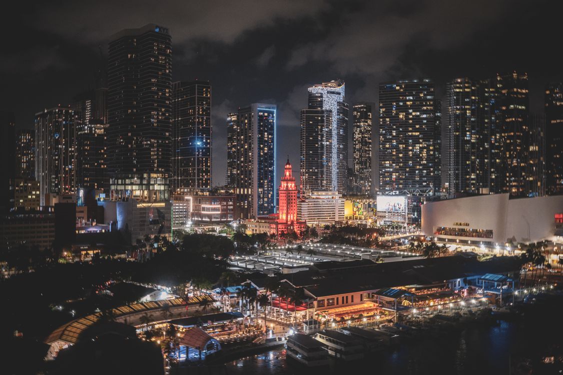 Downtown Miami skyline lit up at night over Biscayne Bay during the World Cup 2026, the luxury rental market drawing global demand