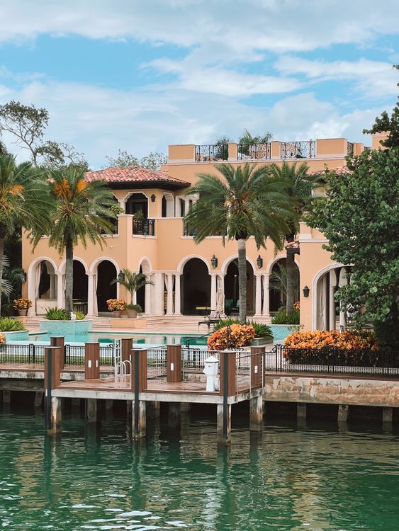 Miami waterfront luxury estate with private dock and pool on Biscayne Bay, the kind of trophy property drawing California buyers ahead of the 2026 wealth tax vote