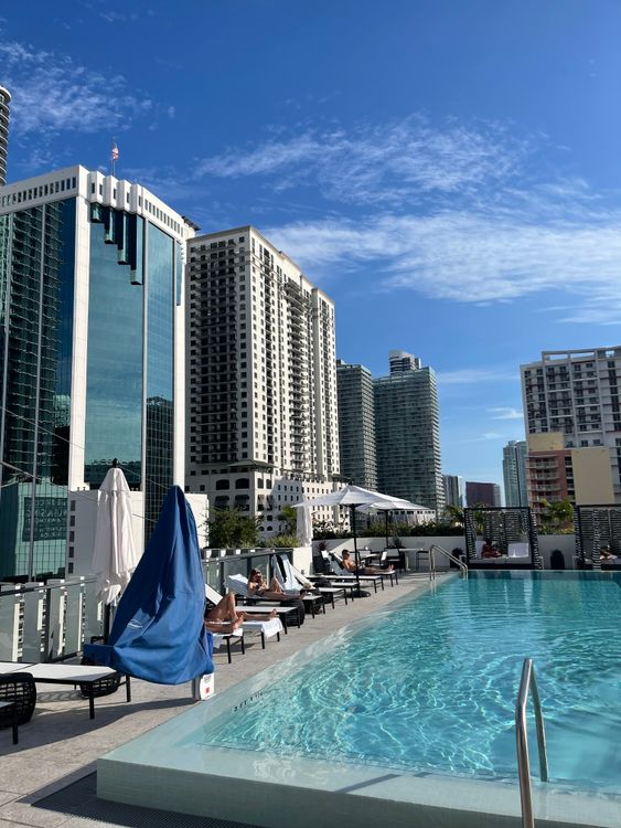 Miami condo rooftop pool with skyline views, similar to the amenity deck planned at 14 ROC