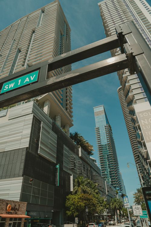 Brickell luxury condo towers at street level on SW 1 Avenue in downtown Miami, the pre-construction corridor tracking the Redfin luxury index