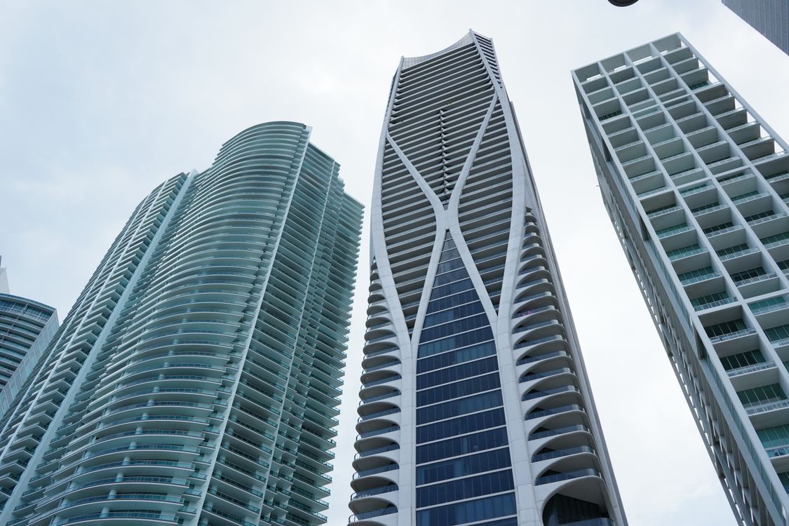 Miami luxury high-rise towers against a clear sky, including One Thousand Museum, reflecting Miami's #2 national ranking for luxury price growth