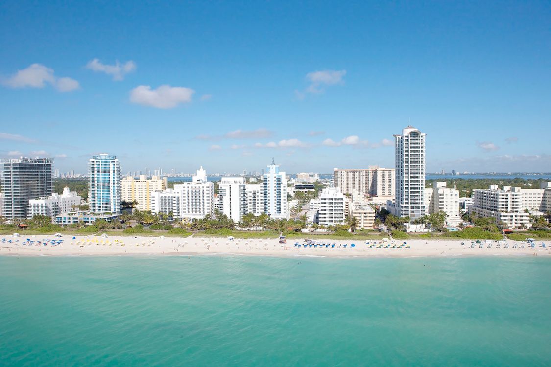Miami Beach oceanfront luxury condo skyline, the branded waterfront product driving Miami's 14.2% luxury price gain