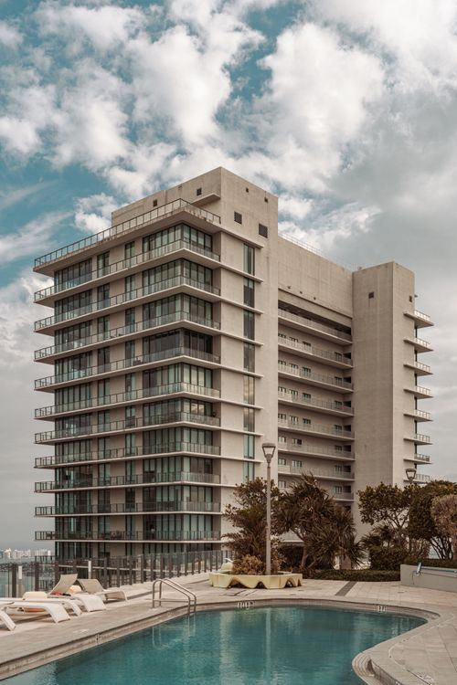 Oceanfront luxury condo tower with pool deck in Surfside, Miami, as a Surf Club Four Seasons unit flips for a 70% resale gain in 2026