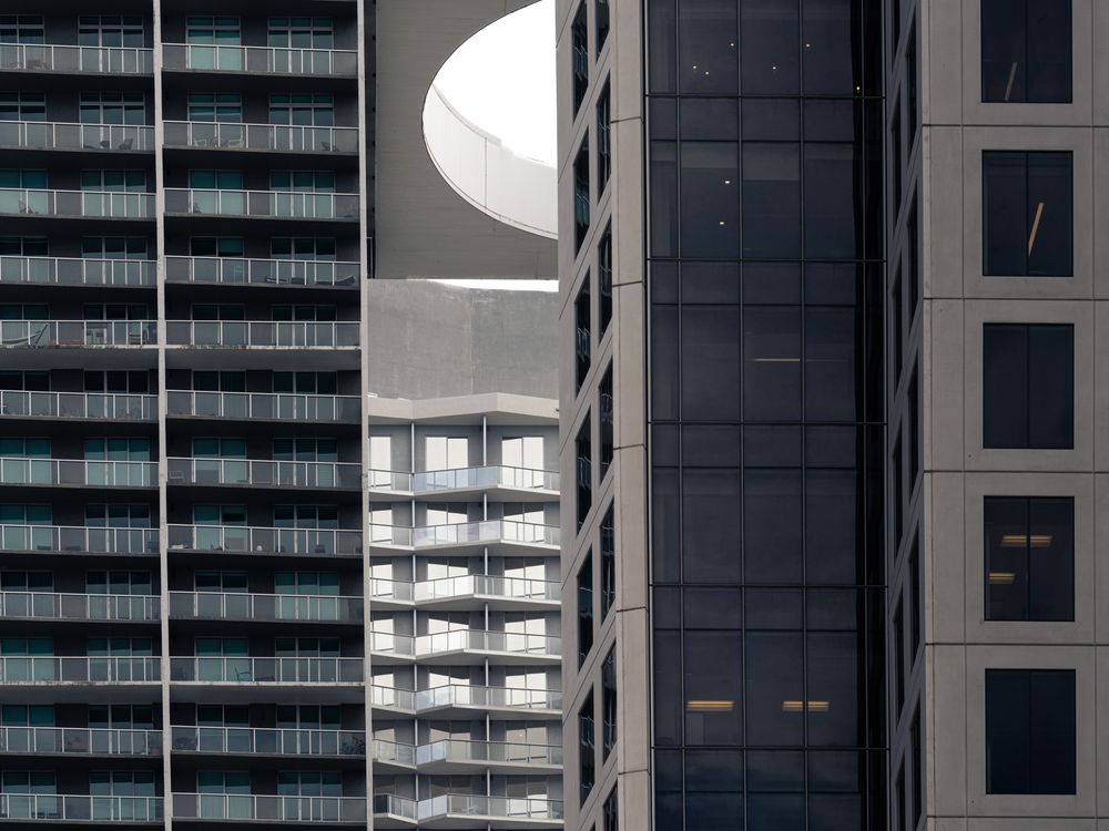 Dense modern Miami residential high-rise facades, the multifamily density the Live Local Act unlocks by overriding local height and density caps