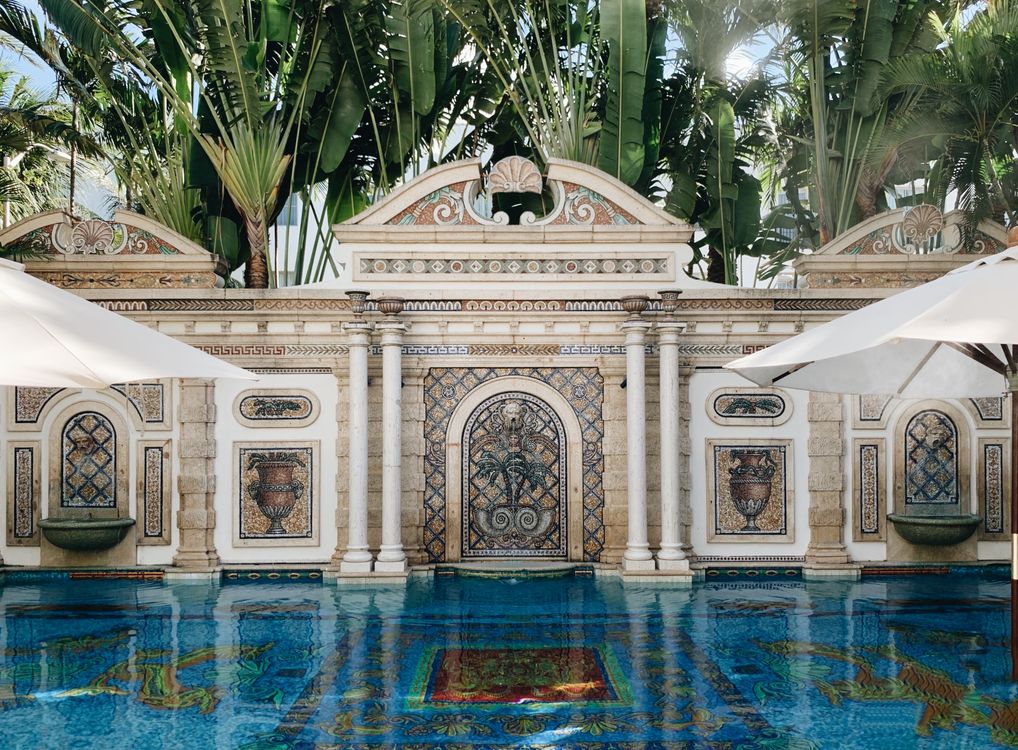 Ornate mosaic pool at the Versace Mansion in South Beach, an example of Miami's top-tier trophy properties distinct from its everyday market
