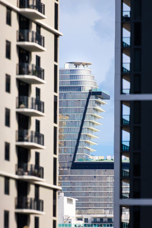 Miami condo towers framed between residential high-rises, illustrating shrinking condo inventory