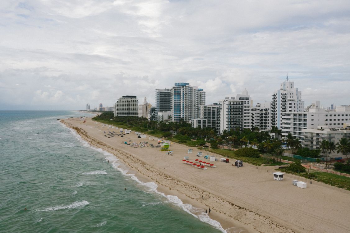 Aerial view of the Miami Beach oceanfront condominium corridor where luxury inventory competes for buyers