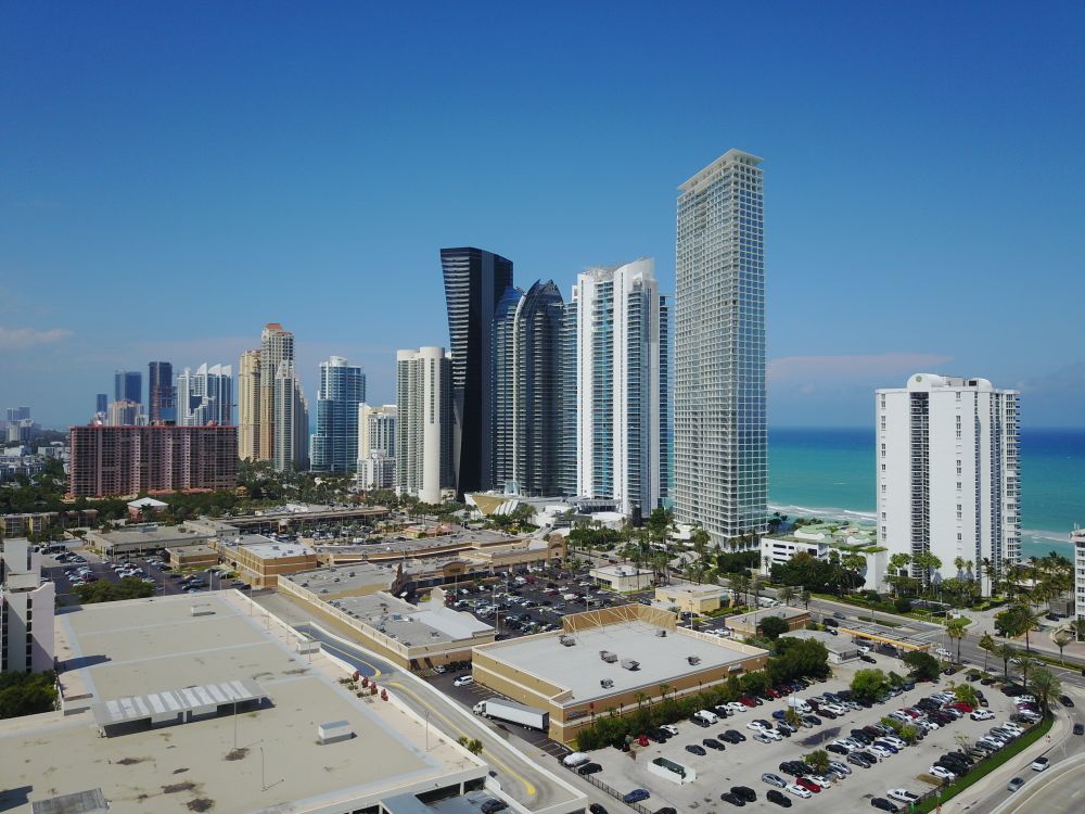 Oceanfront condominium towers along the coastline in Sunny Isles Beach, Florida