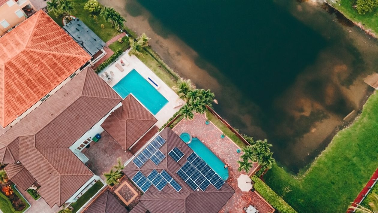 Aerial view of South Florida waterfront luxury homes with private pools in Miami-Dade