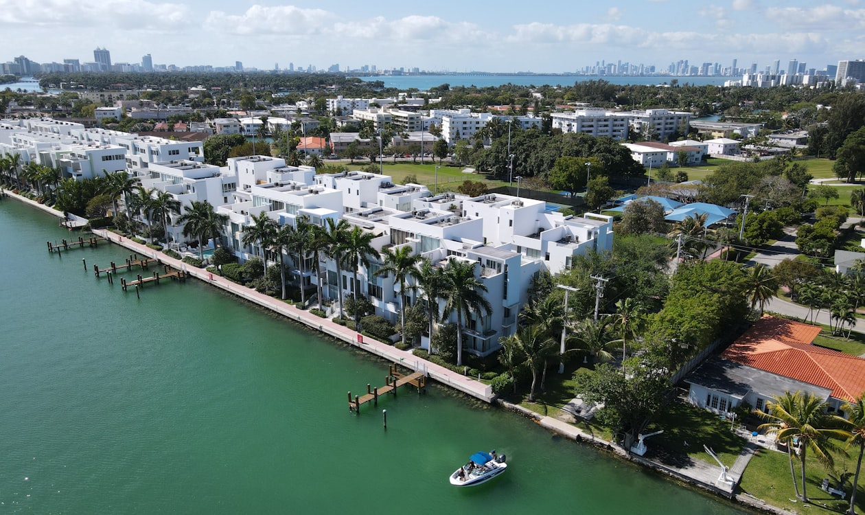 Waterfront condominium residences on Biscayne Bay with the Miami skyline behind them