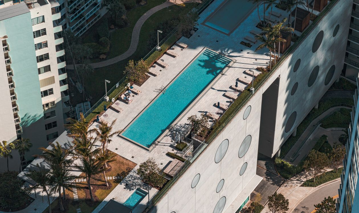 Aerial view of a Miami luxury residential amenity deck with rooftop pool, similar to the program planned at Fouquet's