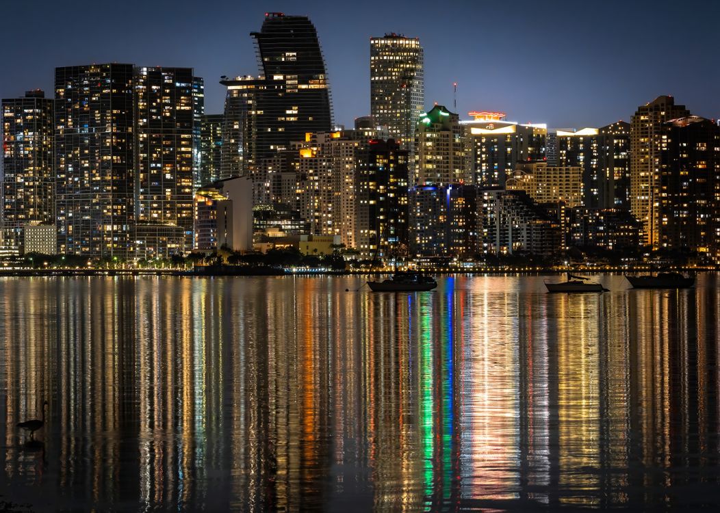 Brickell Miami skyline at night over Biscayne Bay, where Cipriani Residences Miami topped off at 950 feet