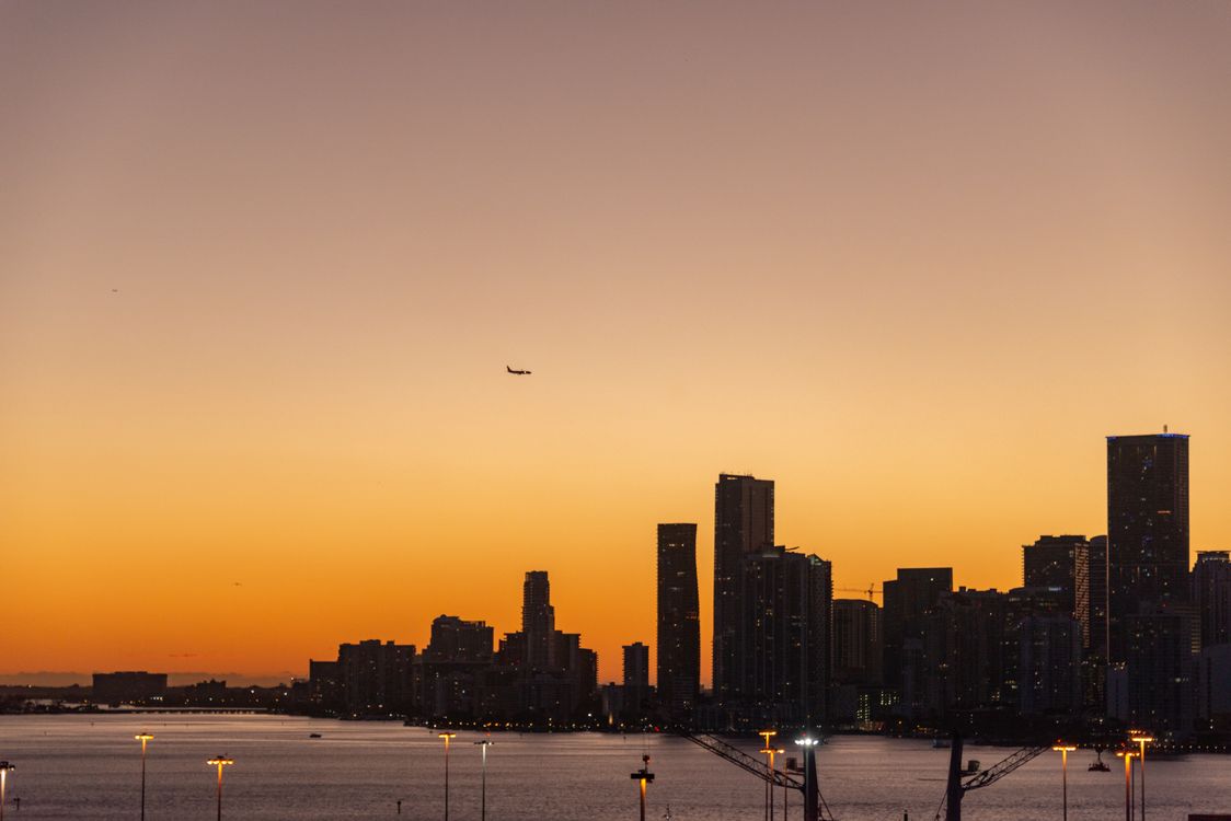 Miami urban skyline at dusk, the market where branded condo towers are delivering through 2027