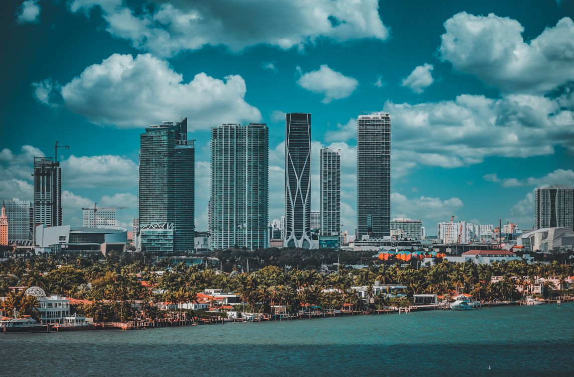 Miami waterfront skyline seen across Biscayne Bay, the market where oceanfront land in enclaves like Golden Beach is repricing