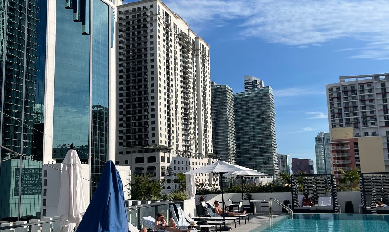 Rooftop pool deck surrounded by Brickell high-rise condominium towers in Miami, Florida