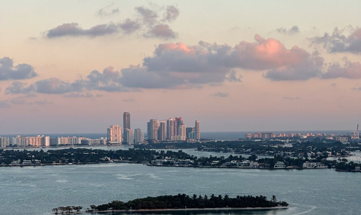 Miami skyline and Biscayne Bay islands at sunset seen from the air