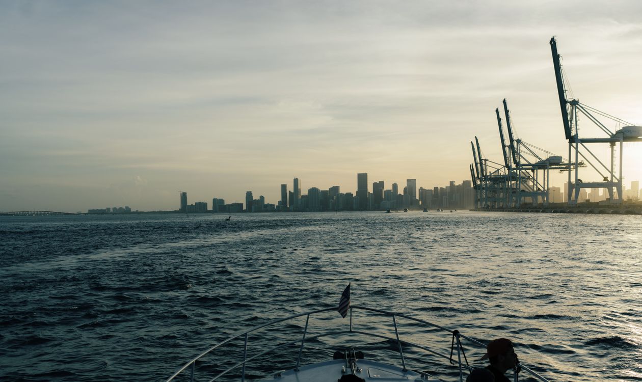 Downtown Miami condo skyline and Port of Miami cranes seen from Biscayne Bay