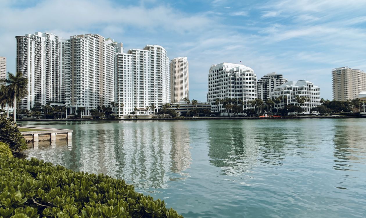 Miami waterfront condo towers across the bay, where adjacent land ownership decides future development risk