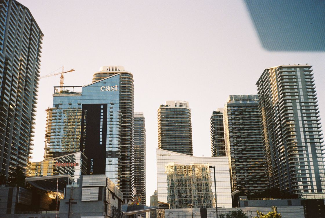 Brickell condo and office towers with an active construction crane in Miami Florida