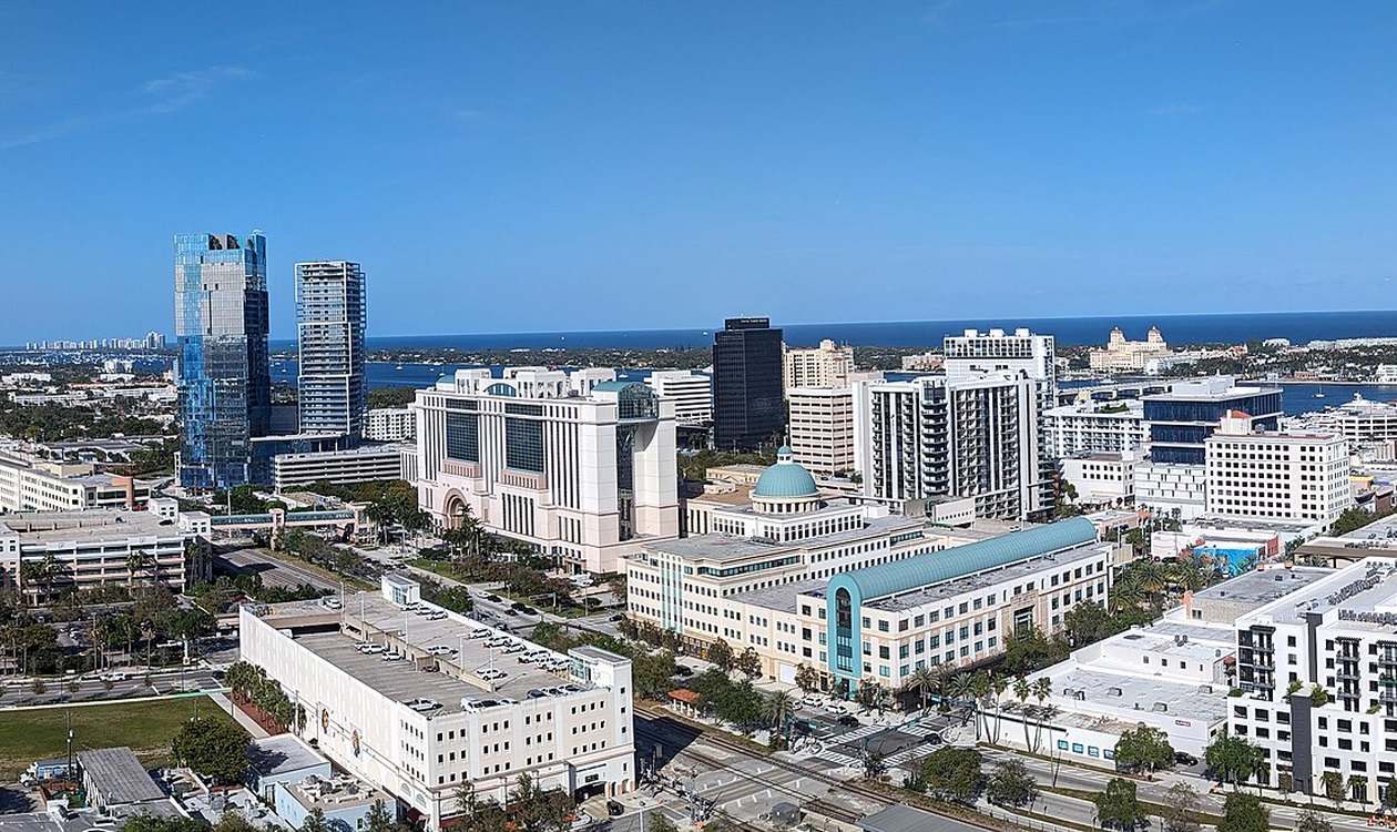 Downtown West Palm Beach towers above the Intracoastal Waterway with Palm Beach island beyond