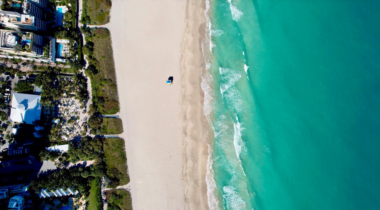 Luxury oceanfront condominiums along the Miami and Surfside coastline at dusk