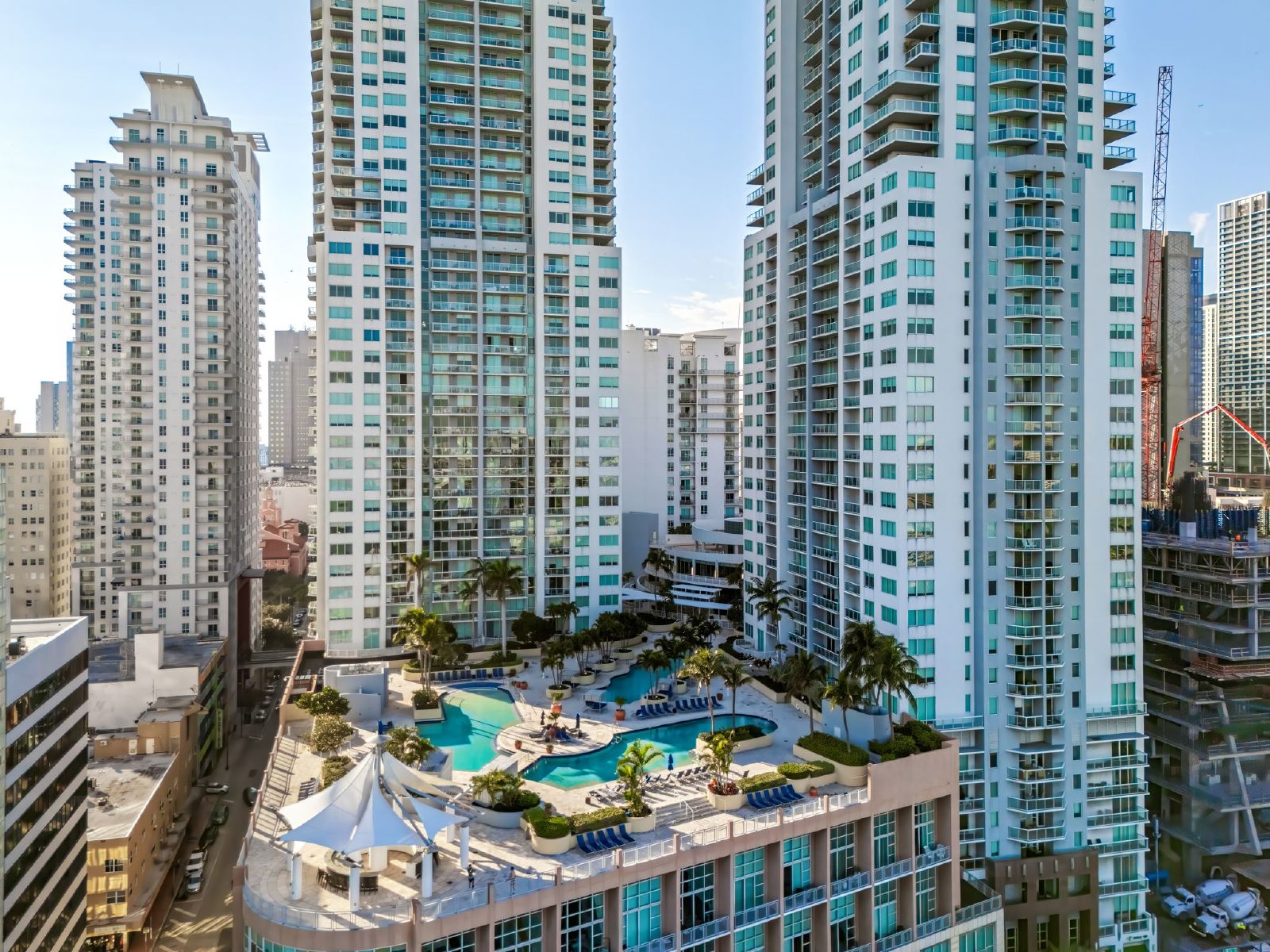 Aerial view of Brickell high-rise condominium towers and amenity pool decks in Miami