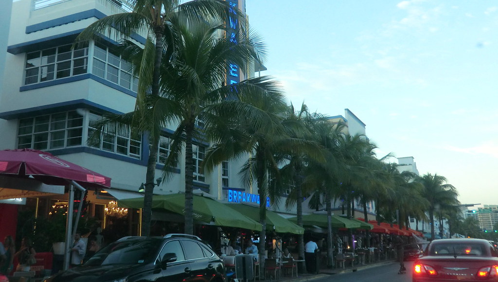 Ocean Drive in South Beach lined with palm trees and pastel Art Deco hotels in Miami Beach, Florida