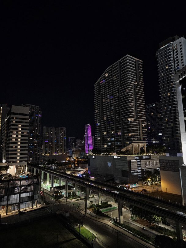 Brickell City Centre district lit up at night with the retail center and residential towers in Miami