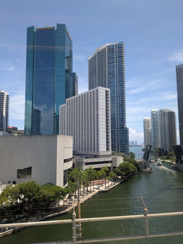 Miami River bridge with Brickell financial district office and condo towers behind it