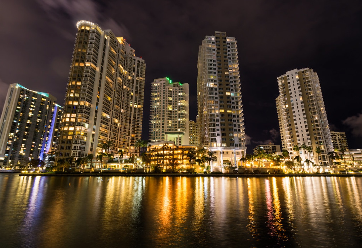 Miami River condo towers lit at night