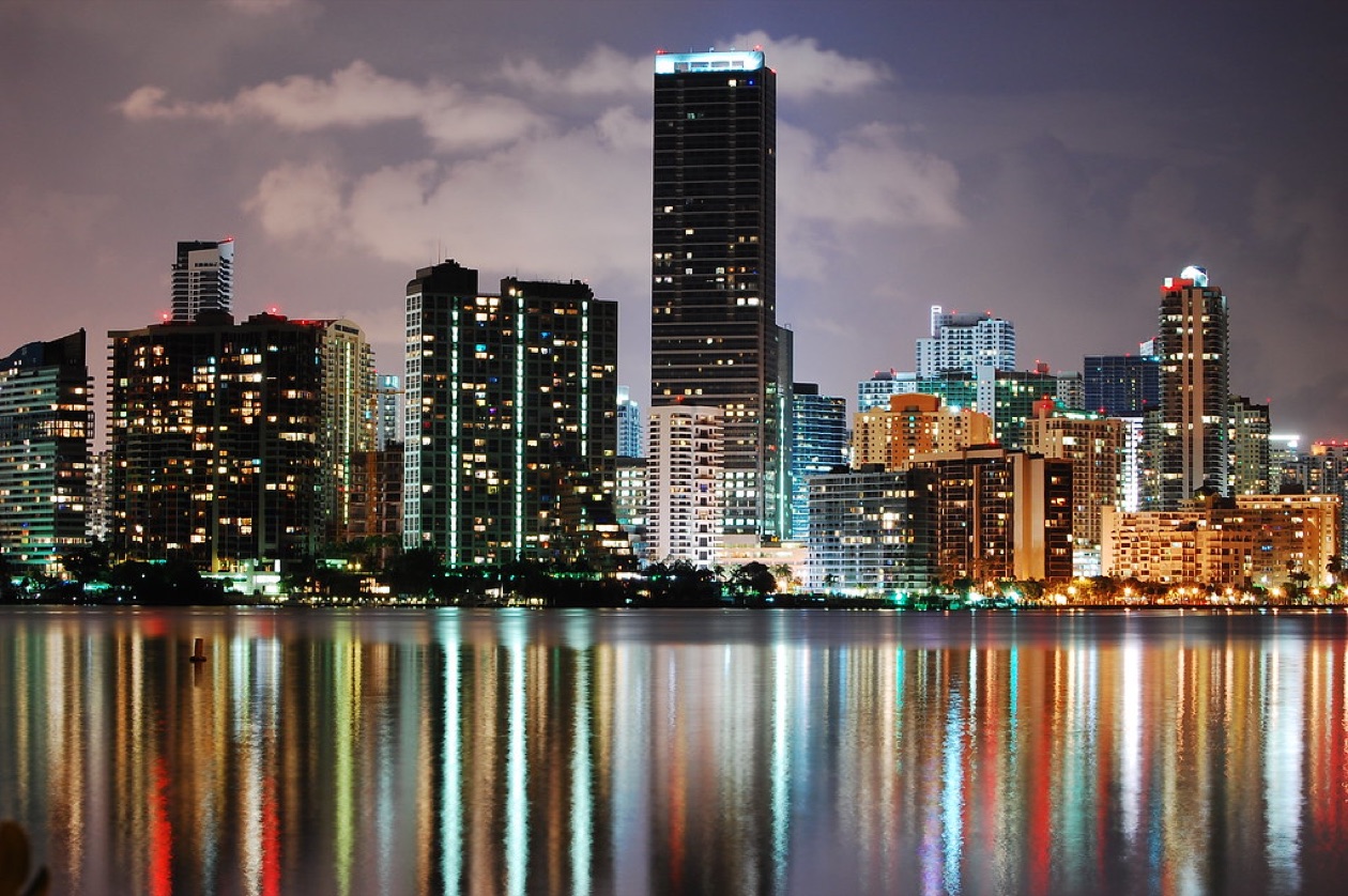 Brickell skyline across Biscayne Bay at night in Miami