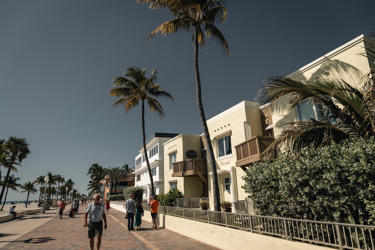 Hollywood Beach Broadwalk in Florida with palm trees and oceanfront low-rise buildings along the 2.5-mile pedestrian promenade