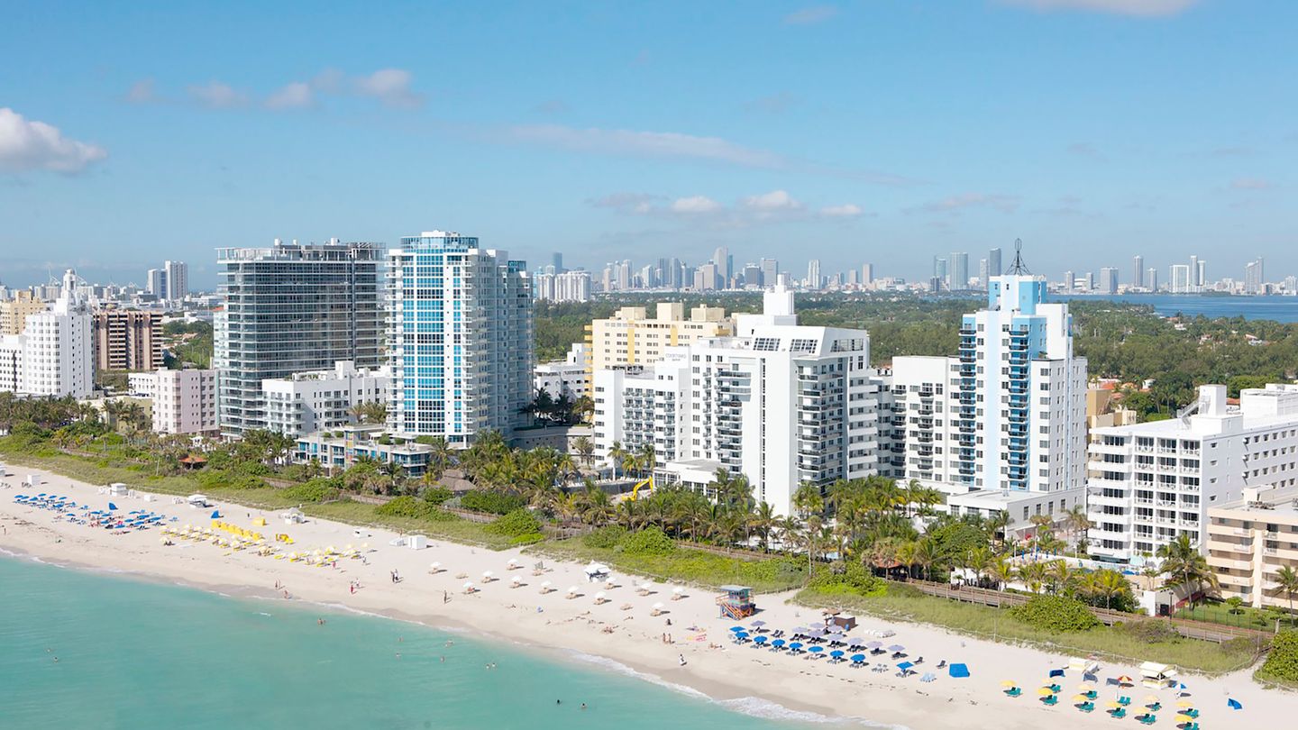 Aerial of aging Miami Beach oceanfront condo towers subject to Florida milestone inspection and reserve rules