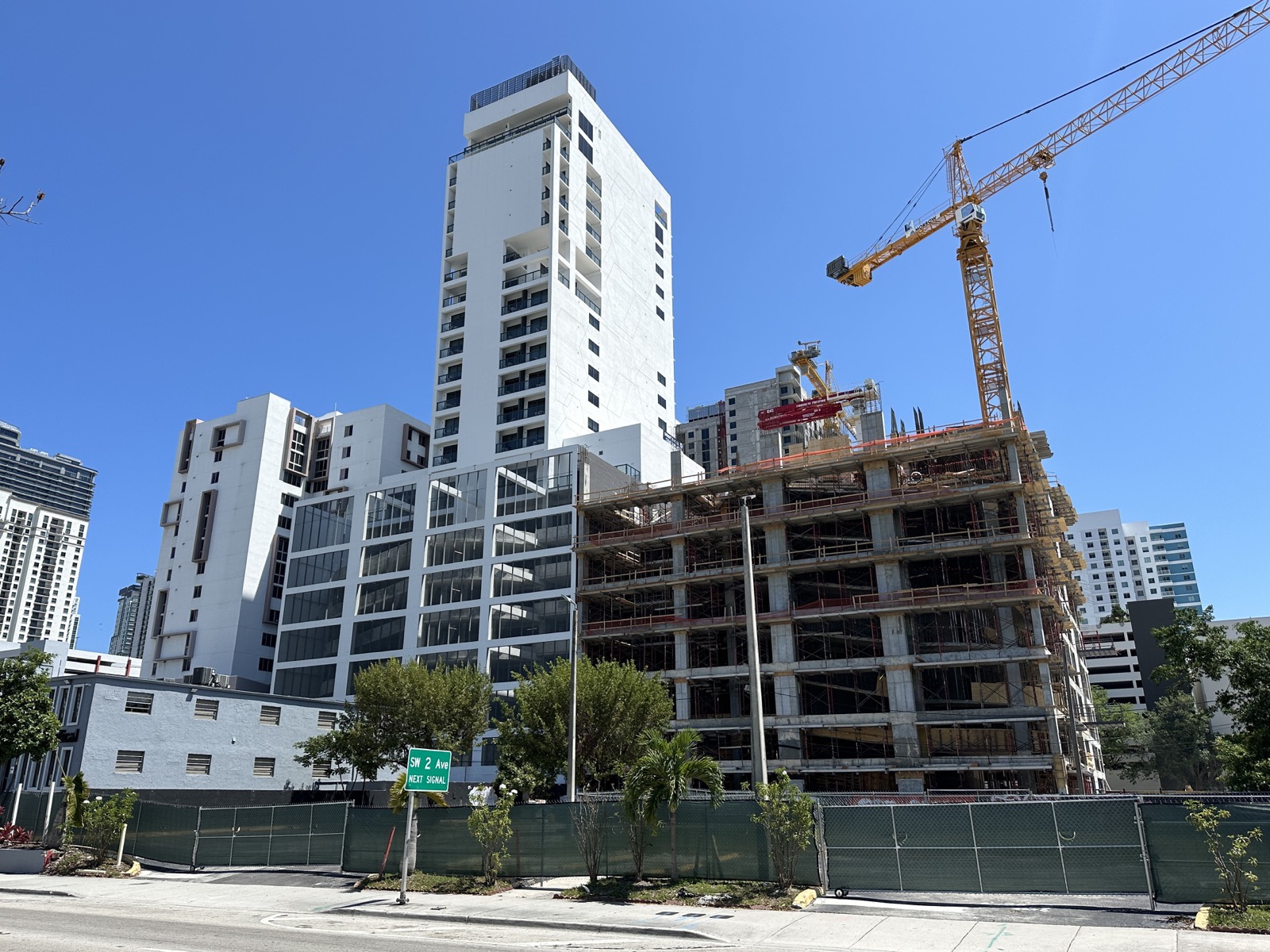 Miami condo tower under construction with a tower crane in Brickell