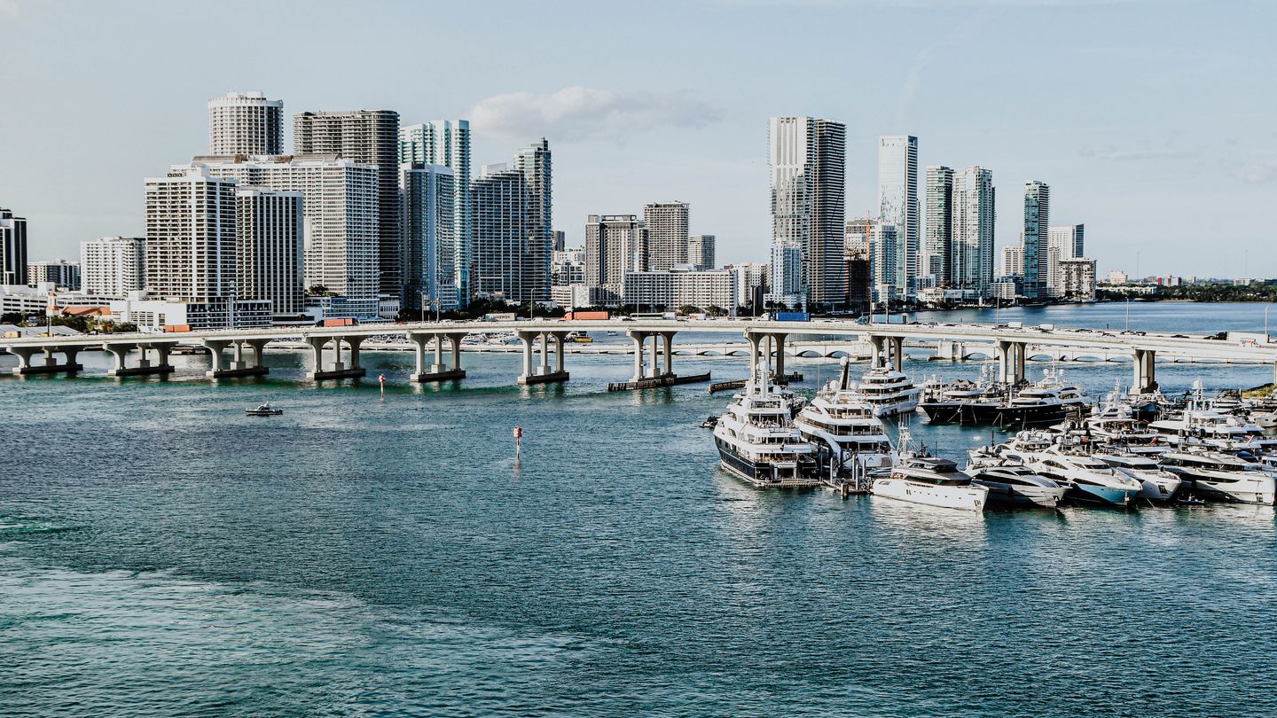 Miami waterfront skyline with luxury condo towers and a yacht marina, the Brickell and downtown pre-construction corridor in 2026