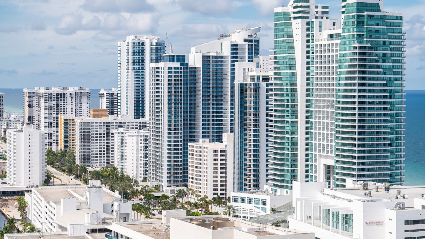 Oceanfront condo towers on Miami Beach seen from the water, similar to the Fontainebleau residential towers